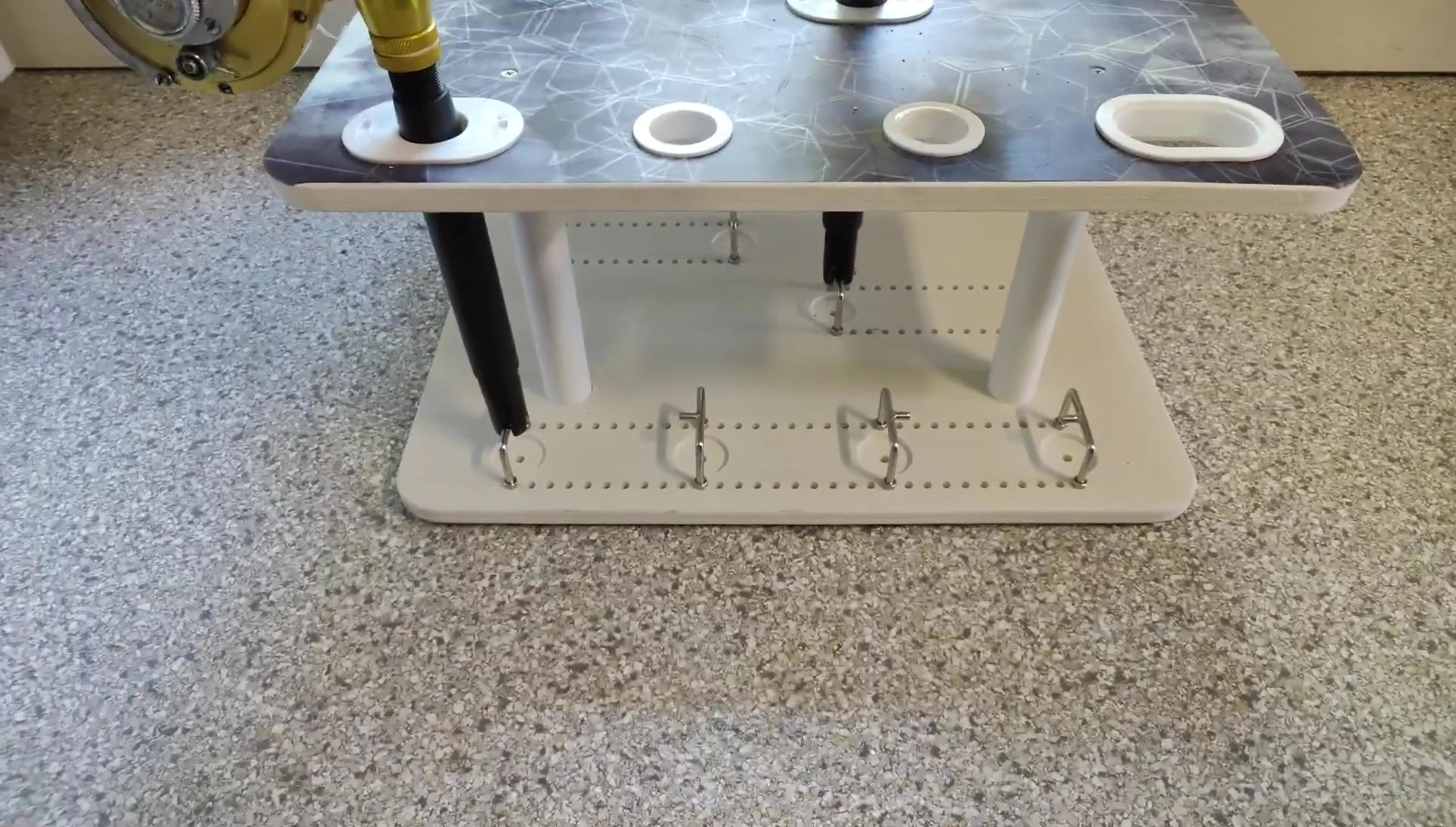 View of the hooks securing a rod butt