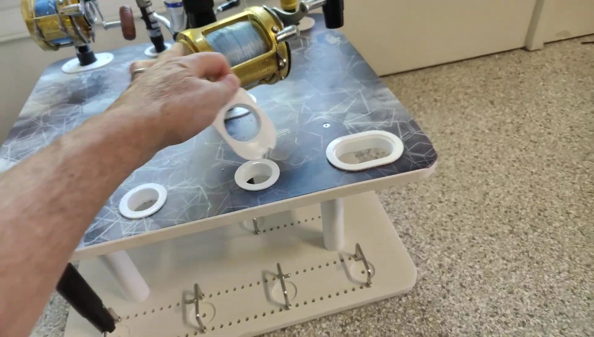 Showing the removable hooks for bent rod storage