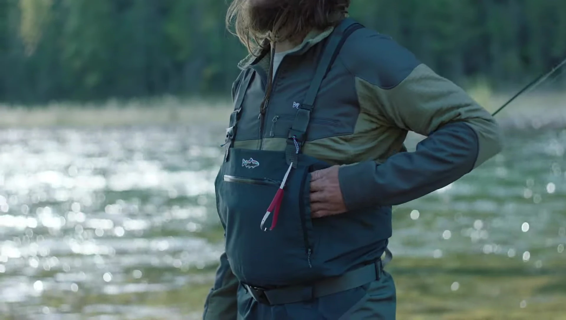 Close-up showcasing the reach-through kangaroo pocket with built-in flaps.