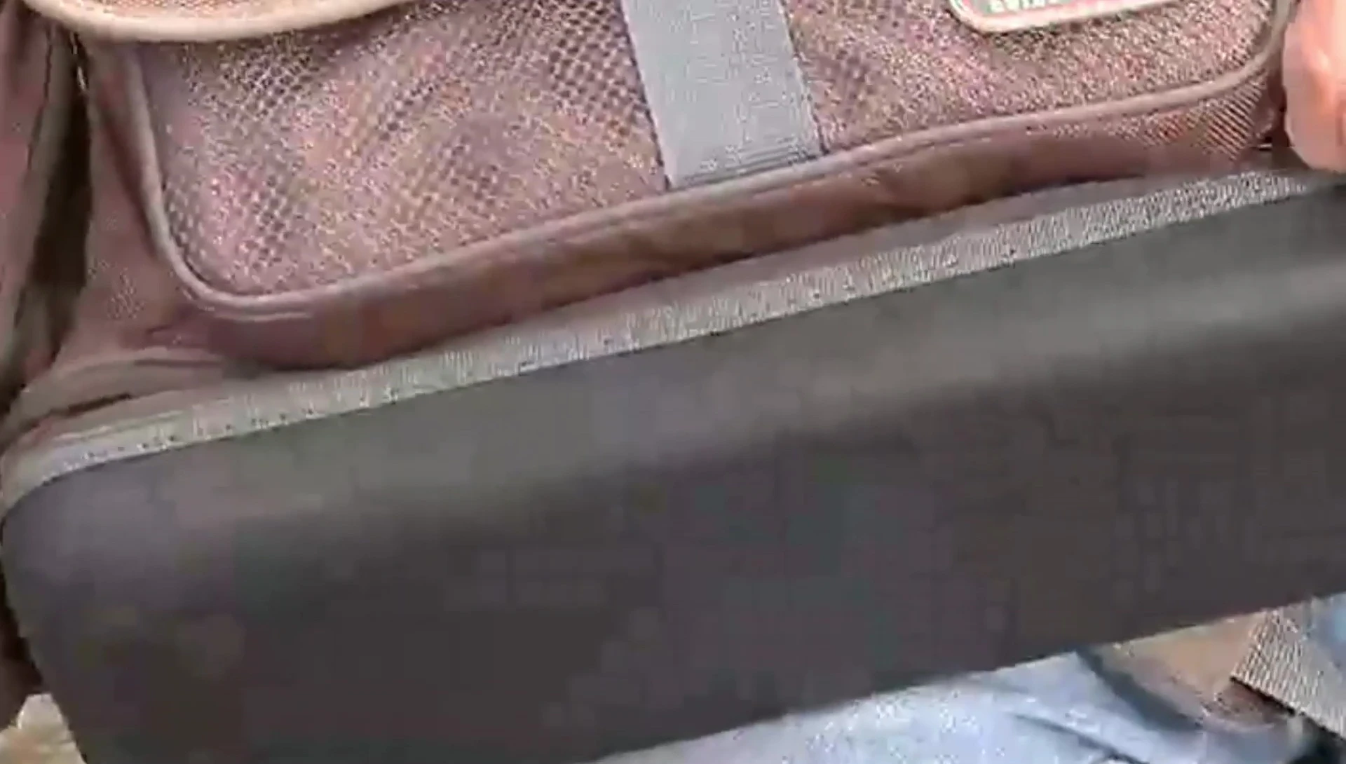 Highlighting the expandable zippered bottom pocket of the Plano 4672 bag