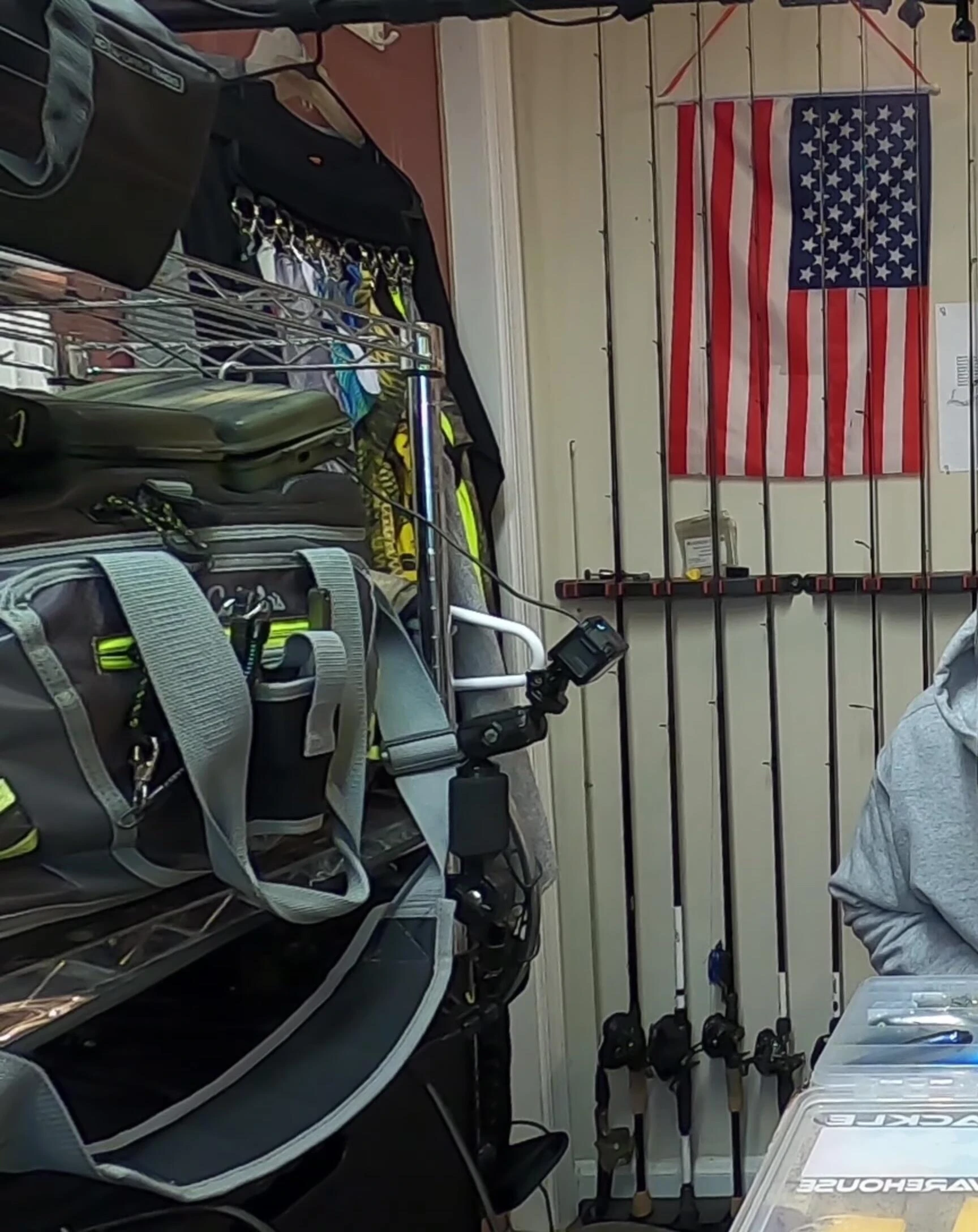 The presenter demonstrates his method of using rubber bands to secure lures.
