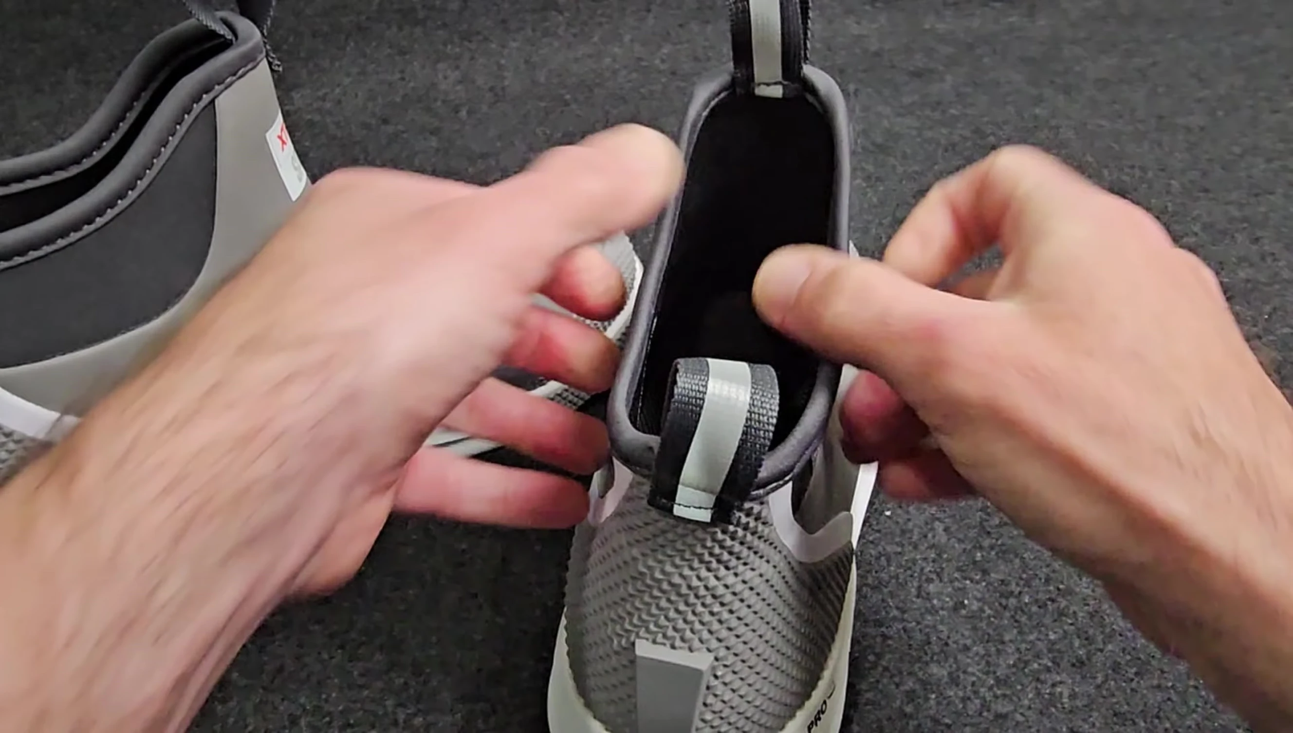The neoprene top of the boot