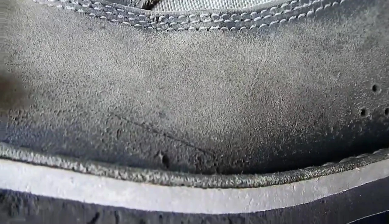 Close-up of a small cut on the leather surface.