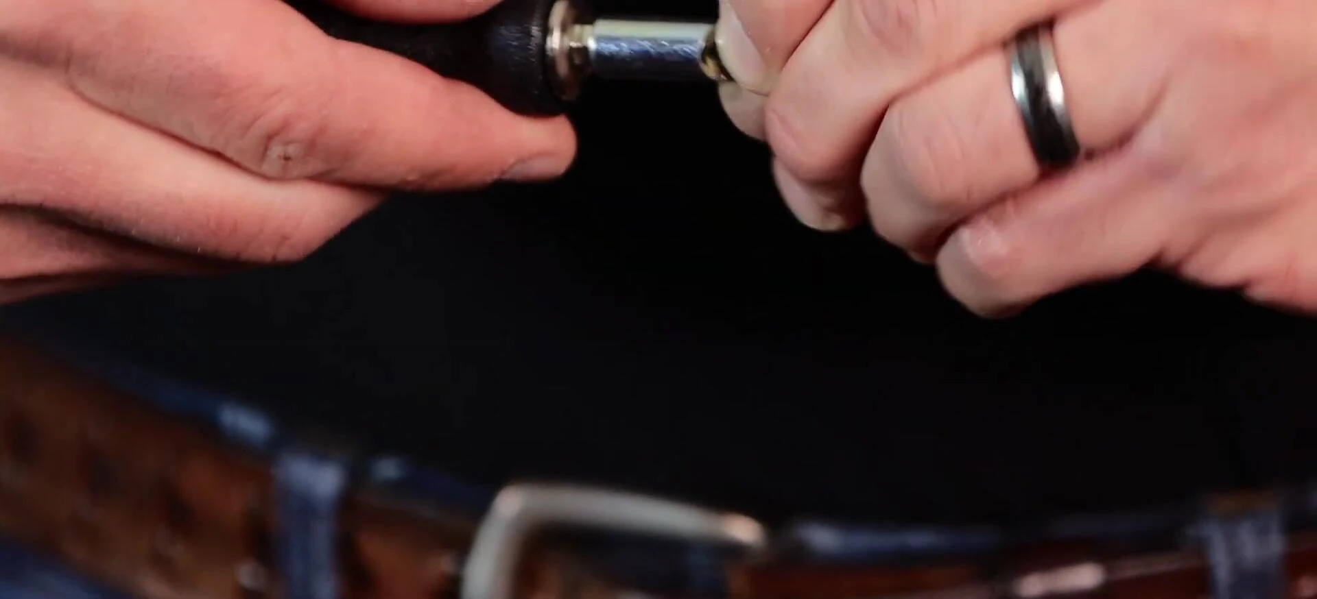 Instructor emphasizing the importance of centering the longer stud.