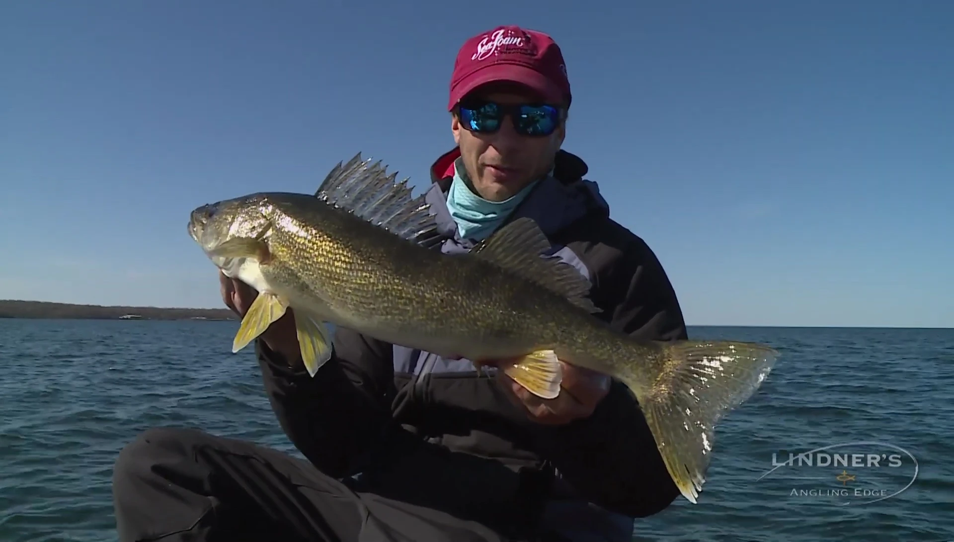 Happy angler holding a fish