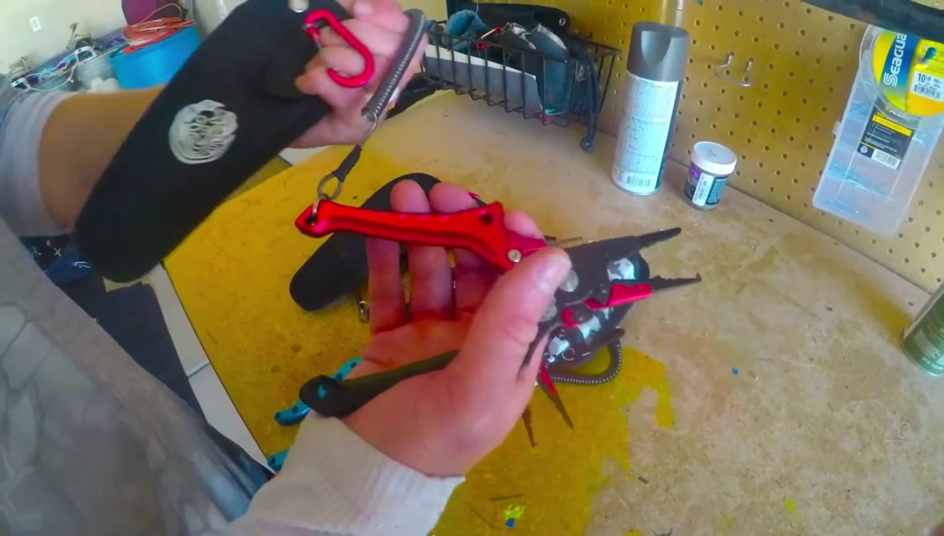 The Kraken Bass pliers with its sheath and lanyard.