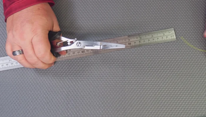 Review of 7.9-inch Multi-tool Pliers: Features a pouch for storage, belt strap, different style cutters, lead biter, and split ring tool. Measures approximately 20cm (8 inches) in length.