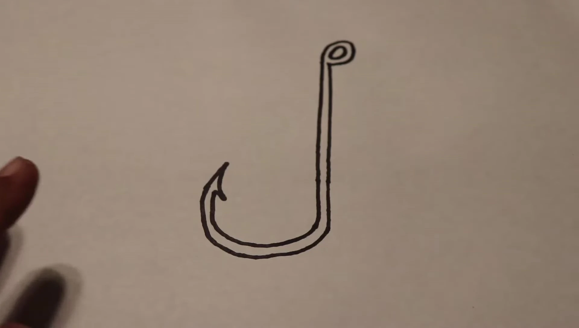 Diagram showing the parts of a fishing hook: eye, shank, bend, point, and barb.