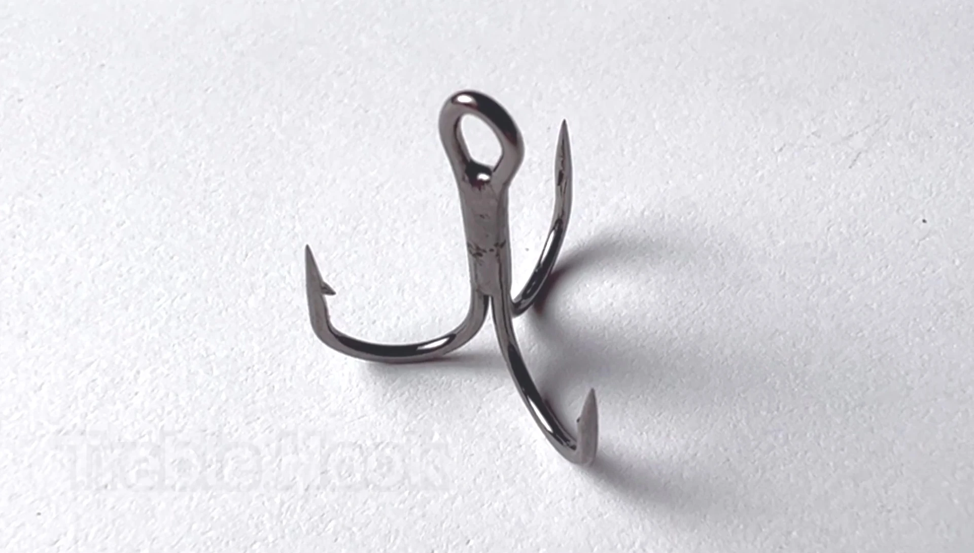 A close-up of a treble hook.