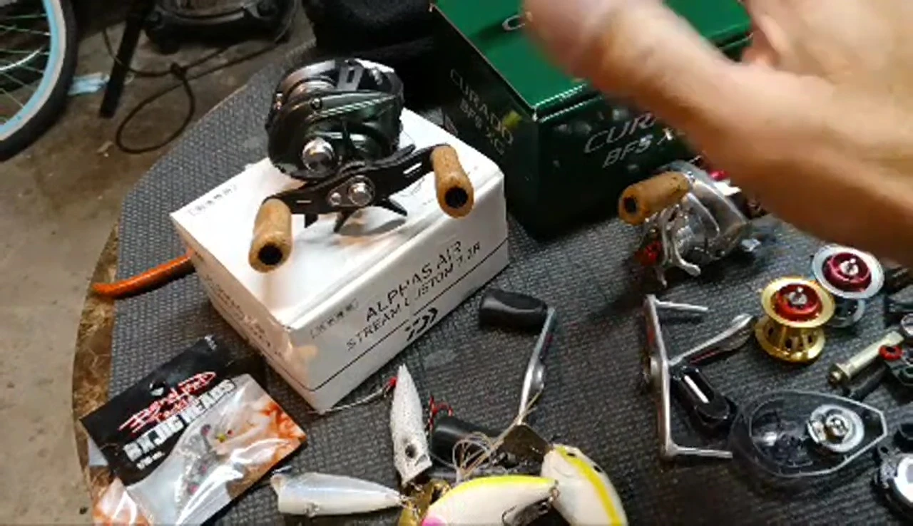 Close-up of a Daiwa reel being discussed for sale.