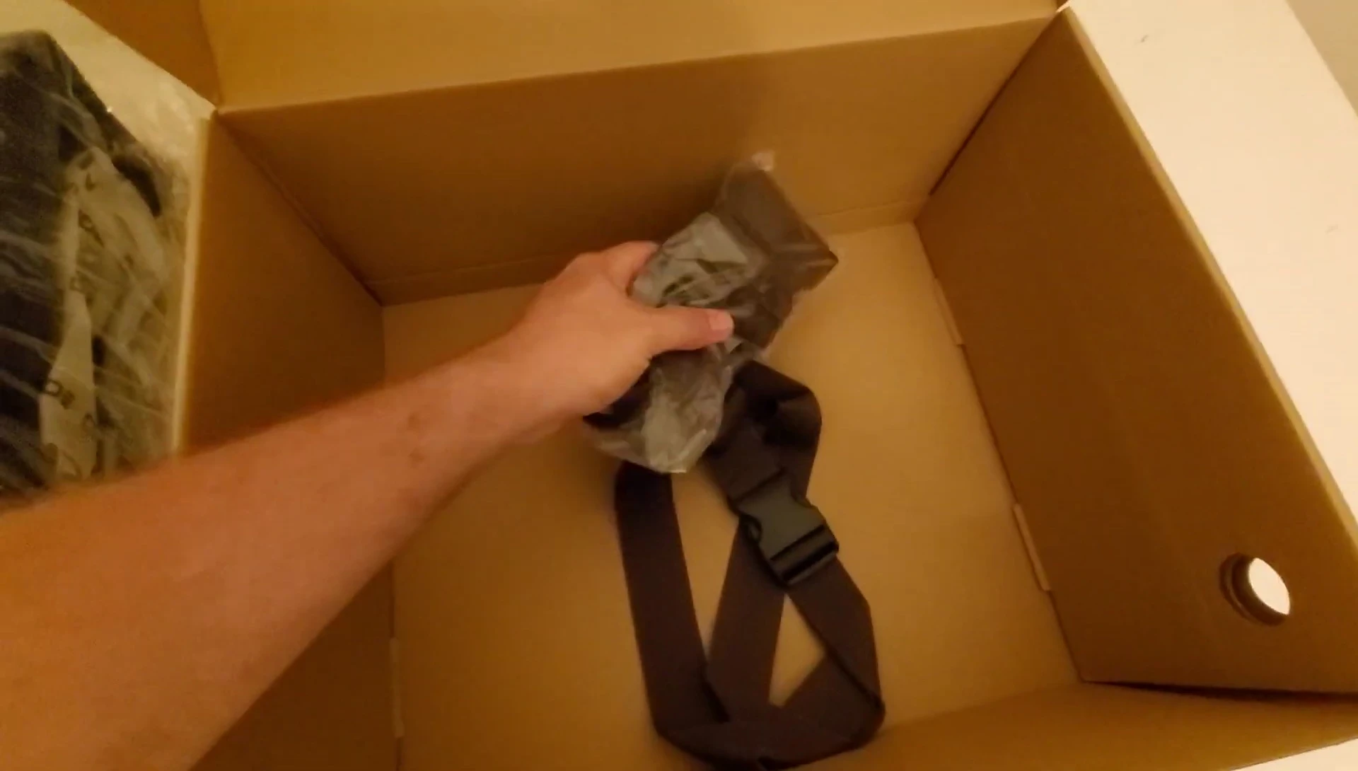 The waders are shown in their packaging, hinting at quality.