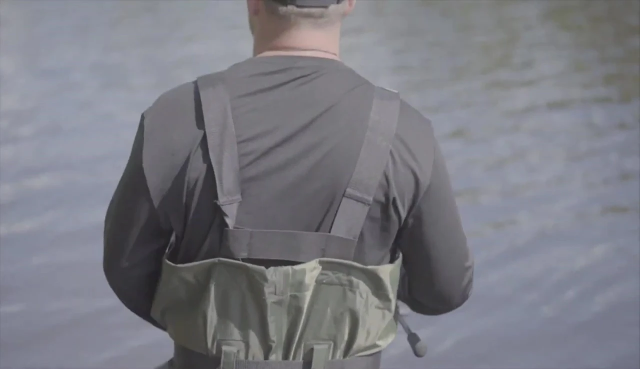 A wide shot of someone wearing the waders, showcasing their overall appearance and functionality.