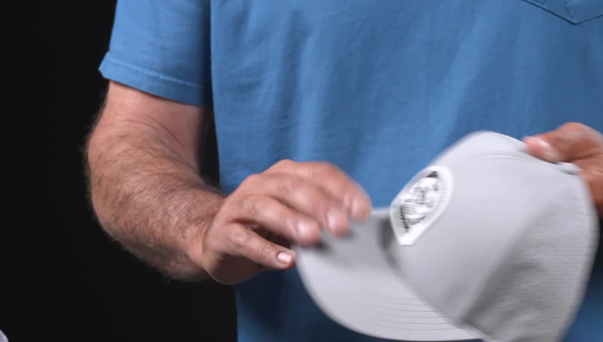 Detail of the laser-cut mesh and adjustable snapback