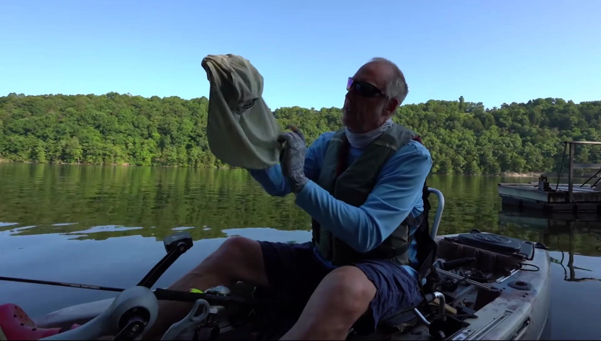 The angler demonstrating the removable back flap.